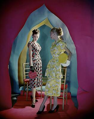 Wall Art featuring the photograph Two Models Beneath Arches Cut Of Colored Paper by Cecil Beaton