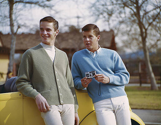 Wall Art featuring the photograph Two Young Men Holding Camera And by Tom Kelley Archive