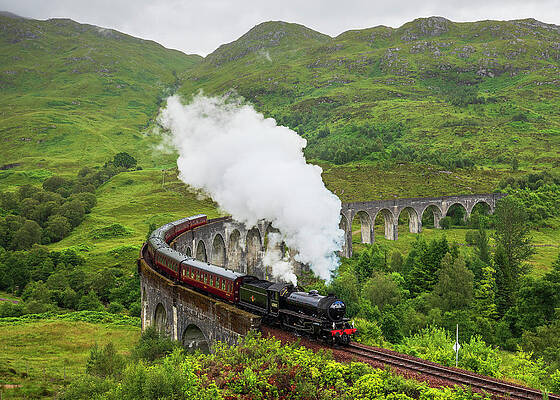 British Wall Art featuring the digital art Uk, Scotland, Highland, Glenfinnan, Great Britain, Highlands, British Isles, Jacobite Steam Train On The Glenfinnan Viaduct Which Inspired The Harry Potter Hogwarts Express by Luigi Vaccarella