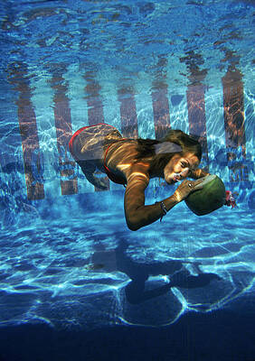 Woman Swimming Underwater with a Ball Wall Art