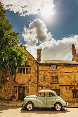 British Wall Art featuring the digital art United Kingdom, England, Gloucestershire, Great Britain, Cotswolds, British Isles, Chipping Campden, An Old Car In Front Of A Traditional House In Chipping Campden On A Sunny Summer Afternoon by Maurizio Rellini