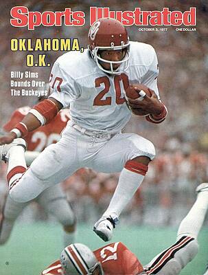 Billy Sims Leaping Over Opponent Wall Art