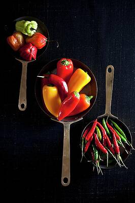 Various Different Chilli Peppers In Pans Seen From Above Print