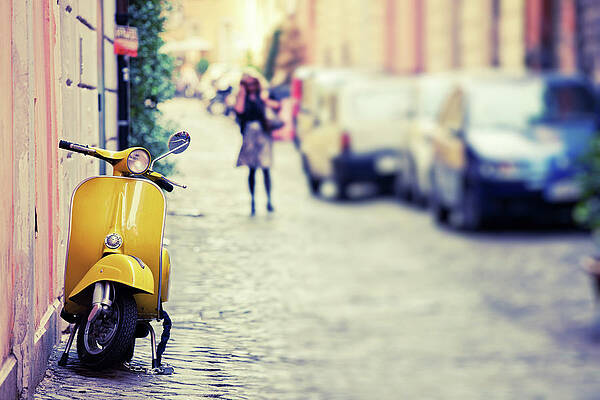 Yellow Scooter on a Cobblestone Street Wall Art