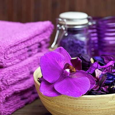 Violet Still-life In Spa Room - Orchid Flowers In Bamboo Dish Next To Stacked Towels Print