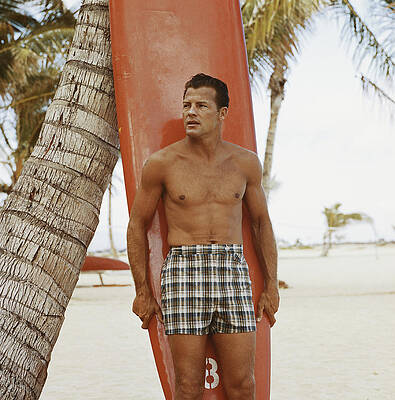 Man Standing with Surfboard on Beach Wall Art