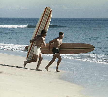 Surfers Running into the Waves Wall Art