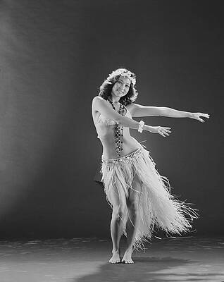Wall Art featuring the photograph Young Woman Hula Dancer Dancing On by Tom Kelley Archive