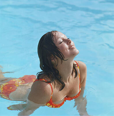 Wall Art featuring the photograph Young Woman In Bikini At Swimming Pool by Tom Kelley Archive