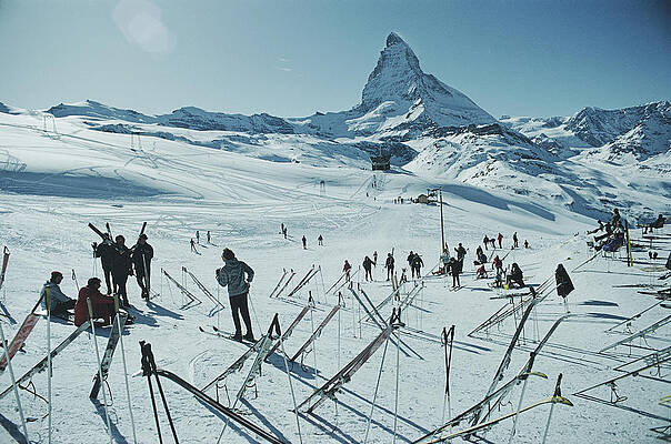 Skiers at the Base of a Majestic Mountain Wall Art