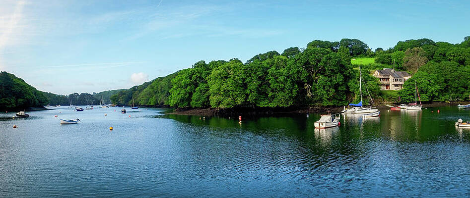 Tranquil River Scene with Boats Photograph