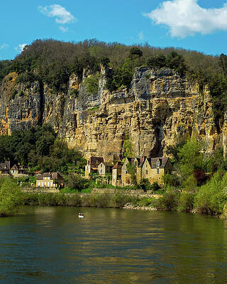 Architecture Photograph - Canoes Pass La Roque-Gageac On The Dordogne River #1 by Seeables Visual Arts
