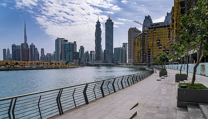Modern Wall Art featuring the photograph Low Rise Homes In Front Of Modern Apartments Of Dubai Downtown D #1 by Steven Heap