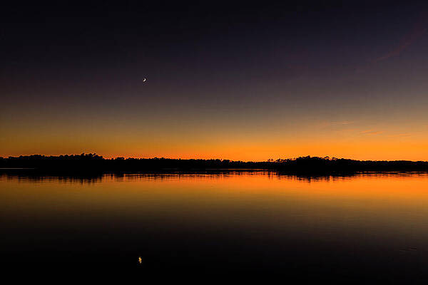 Serene Sunset Over Water Photograph