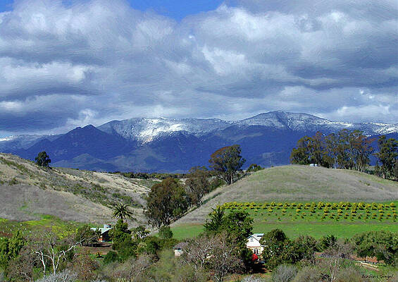 Snow-Capped Mountains and Rolling Hills Photograph