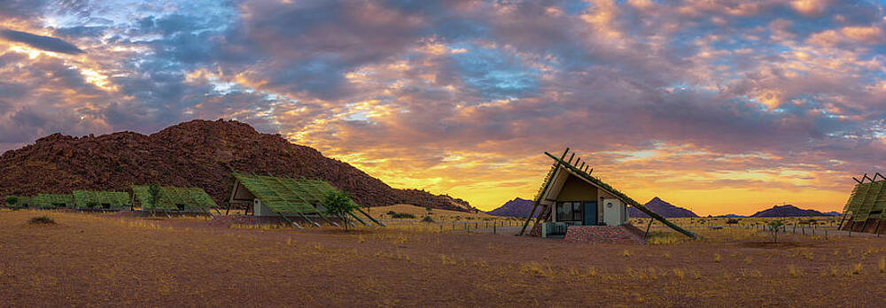 Sunrise Wall Art featuring the photograph Sunrise Above Small Chalets Of A Desert Lodge Near Sossusvlei In Namibia #1 by Miroslav Liska