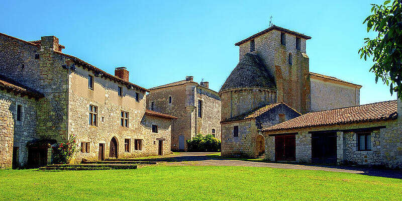 Medieval Stone Buildings Under Blue Sky Photograph
