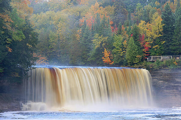Majestic Waterfall in Autumn Forest Photograph
