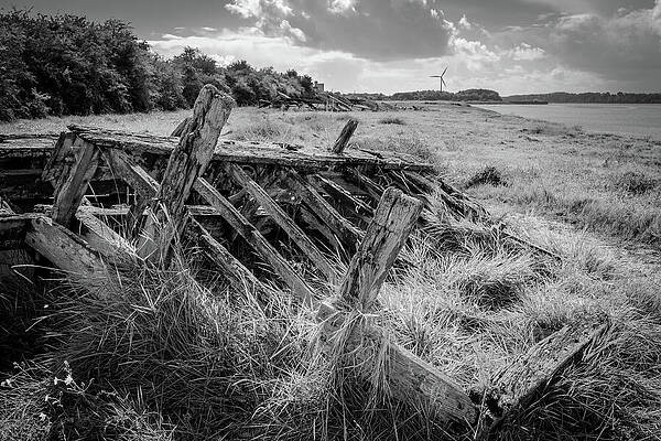 Abandoned Shipwreck on Grassy Shore Photograph