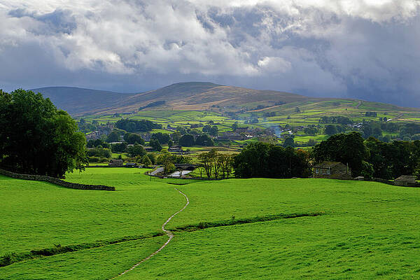 Rolling Hills Under a Cloudy Sky Photograph