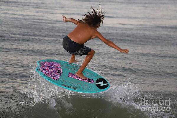 Surfer Performing a Jump Photograph