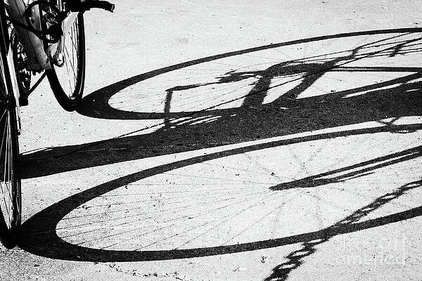 Wall Art featuring the photograph A Bike Shadow Black And White by Tatiana Travelways
