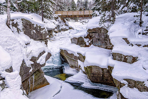 Wall Art featuring the photograph A Couple On The Bridge, Winter At Upper Ammonoosuc Falls. by Jeff Sinon