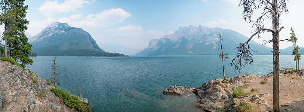 Wilderness Wall Art featuring the photograph Alcove In The Shore Of Lake Minnewanka In Banff by John Twynam