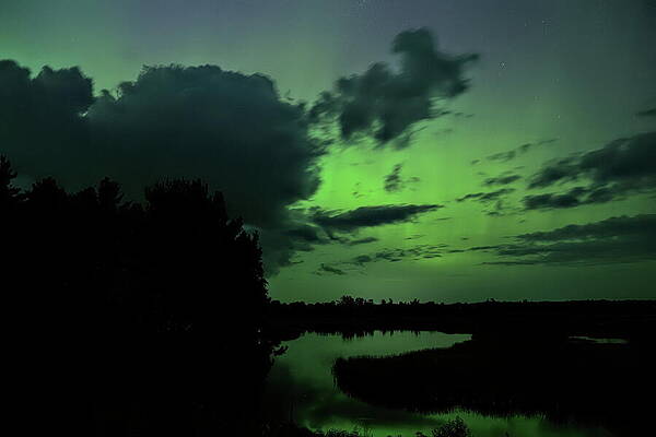 Wall Art featuring the photograph Aurora Clouds Over The Backwater by Dale Kauzlaric