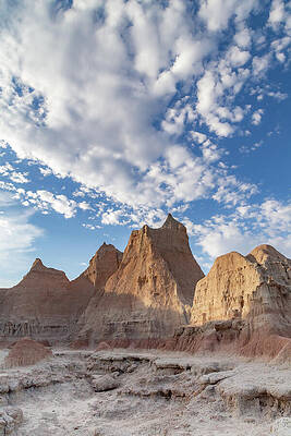 Dramatic Rock Formations Under Cloudy Sky Photograph