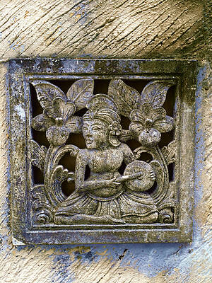 Serene Wall Art featuring the photograph Bali Serene Figure In Weathered Stone Frame by Travel Essayist