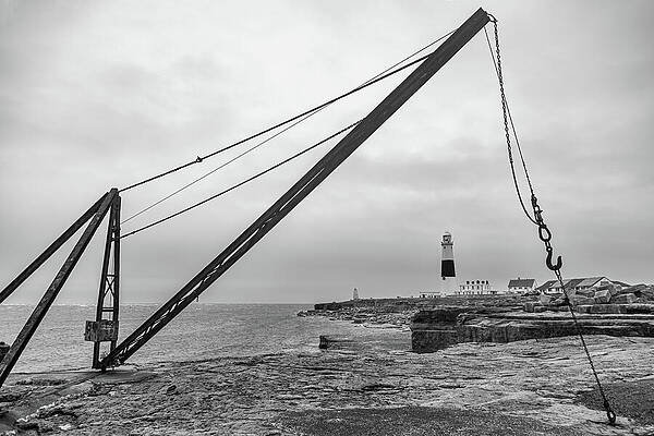 Old Crane and Distant Lighthouse Wall Art