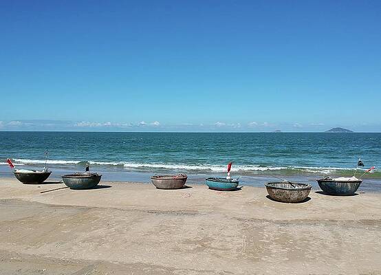 Basket Boats on the Beach by Ed Wilkerson