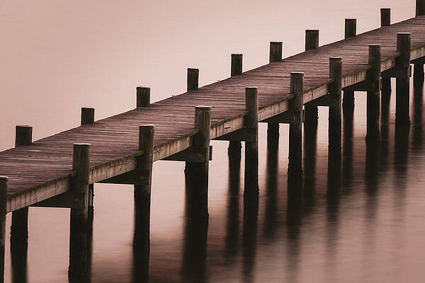 Water Wall Art featuring the photograph Bay Resort Pier At Dusk by Jason Fink