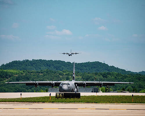 Wall Art featuring the photograph C130 Super Hurcules Landing by Flees Photos