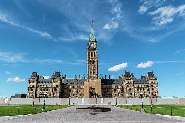 Architecture Photograph - Canadian Parliament From The Front With Centennial Flame by John Twynam