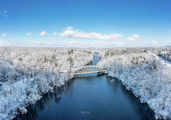 Snowy Bridge Over a Tranquil River Wall Art