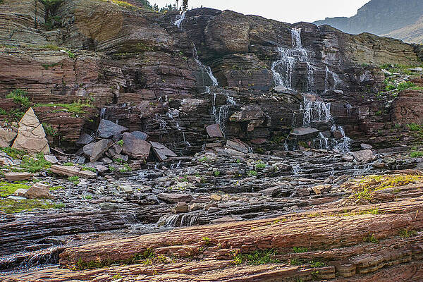 Wilderness Wall Art featuring the photograph Cascade On A Wall Near Logan Pass In Gacier National Park by Nancy Gleason