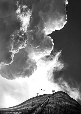 Child Flying Kite Under Dramatic Clouds Photograph
