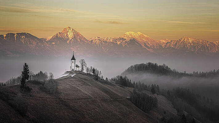 Winter Wall Art featuring the photograph Church Of St. Primoz And Felicijan At Sunset by Charnwood Photography Fine Art