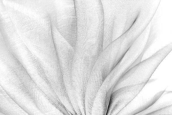 Clothing Photograph - Closeup Of The Wavy White Organza Fabric by Severija Kirilovaite