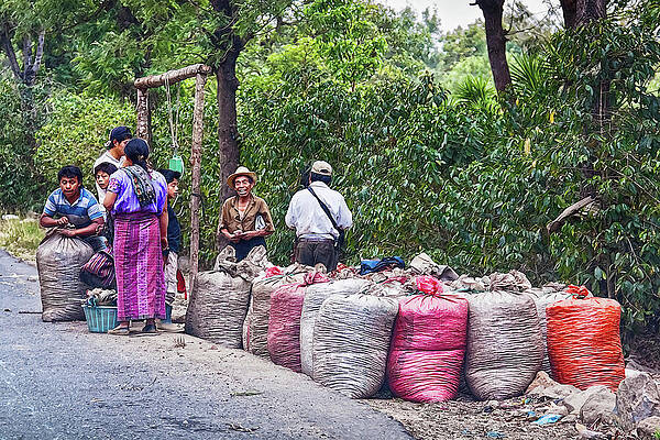 People Gathering Near Colorful Sacks Wall Art