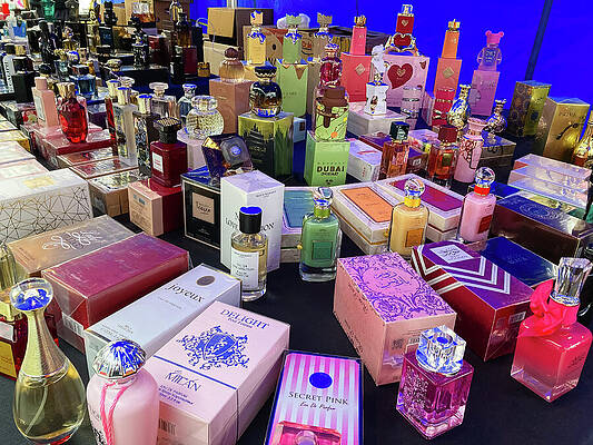 Colorful Perfume Bottles on Display Wall Art