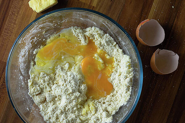 Raw Photograph - Cracked Eggs In A Clear Bowl Of Flour And Cheese by Scott Lyons