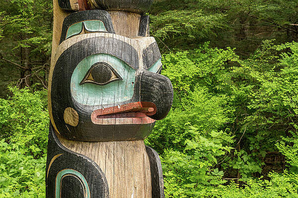 Wall Art featuring the photograph Detail Of Carved Totem Pole In The Sitka National Historical Par by Steven Heap