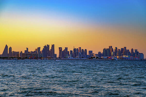 Wall Art featuring the photograph Doha Skyline At Sunset Across The Arabian Gulf by Miroslav Liska