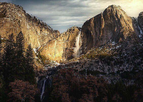 Majestic Mountain Waterfall at Sunset Photograph