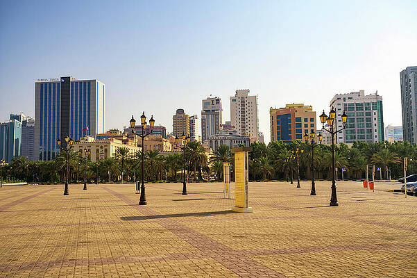 Wall Art featuring the photograph Downtown Manama Skyline With Palm Trees And Open Plaza by Miroslav Liska