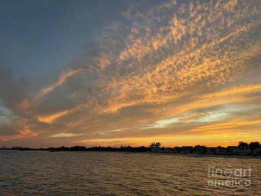Dramatic Sunrise Over Calm Waters by Catherine Wilson