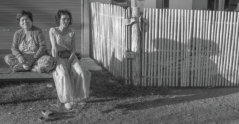 Place Wall Art featuring the photograph Drifting - Two Ladies In A Village In Thailand by Jeremy Holton